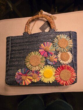 Blue wicker bag, NWT, straw flowers on front of bag